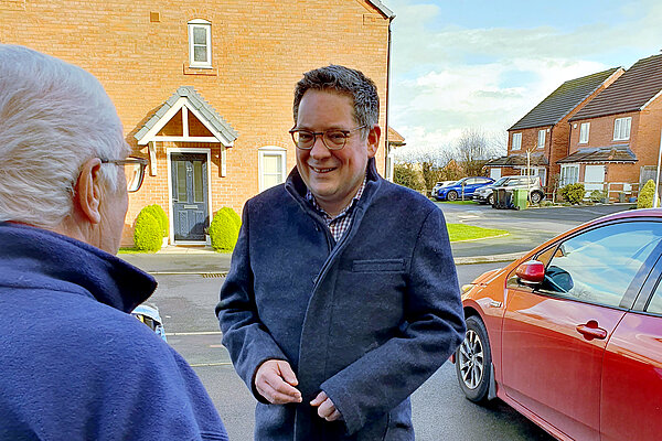 David Ellams canvassing a resident