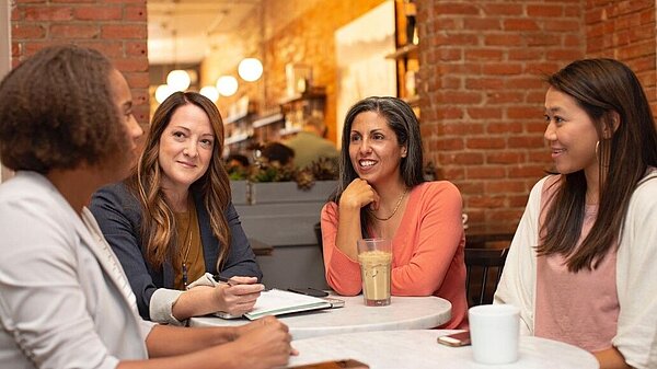 A group of people in a meeting