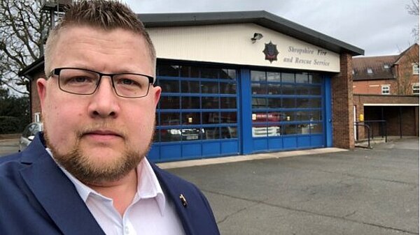 Cllr Thomas Janke stands in front of Newport Fire Station
