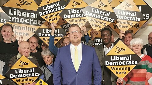 Telford and Wrekin Liberal Democrats members holding diamond signs stating "Liberal Democrats winning here"