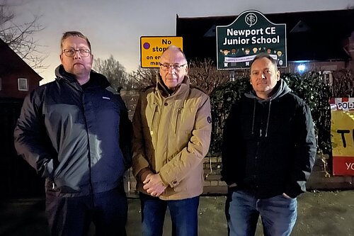 Cllr Thomas Janke discusses the disappointing scrapping of the scheme for a safer school run with Cllr Mark Wiggin and Cllr Paul Crewe outside Newport Junior School