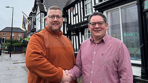Cllr Thomas Janke shakes hands with David Ellams on Newport Hight Street